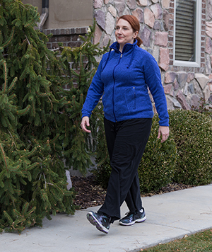 Woman walking outdoors.